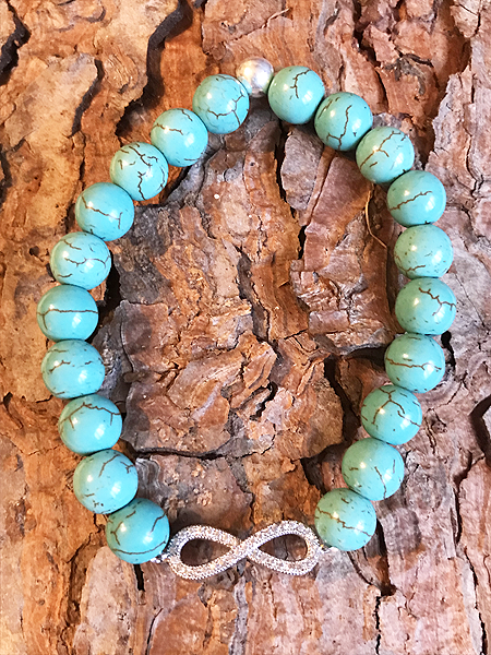 Bracciale in turchese con infinito in metallo rodiato